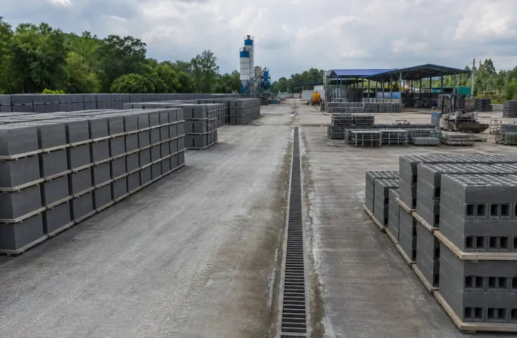 Well-organized concrete block curing yard with proper stacking and spacing
