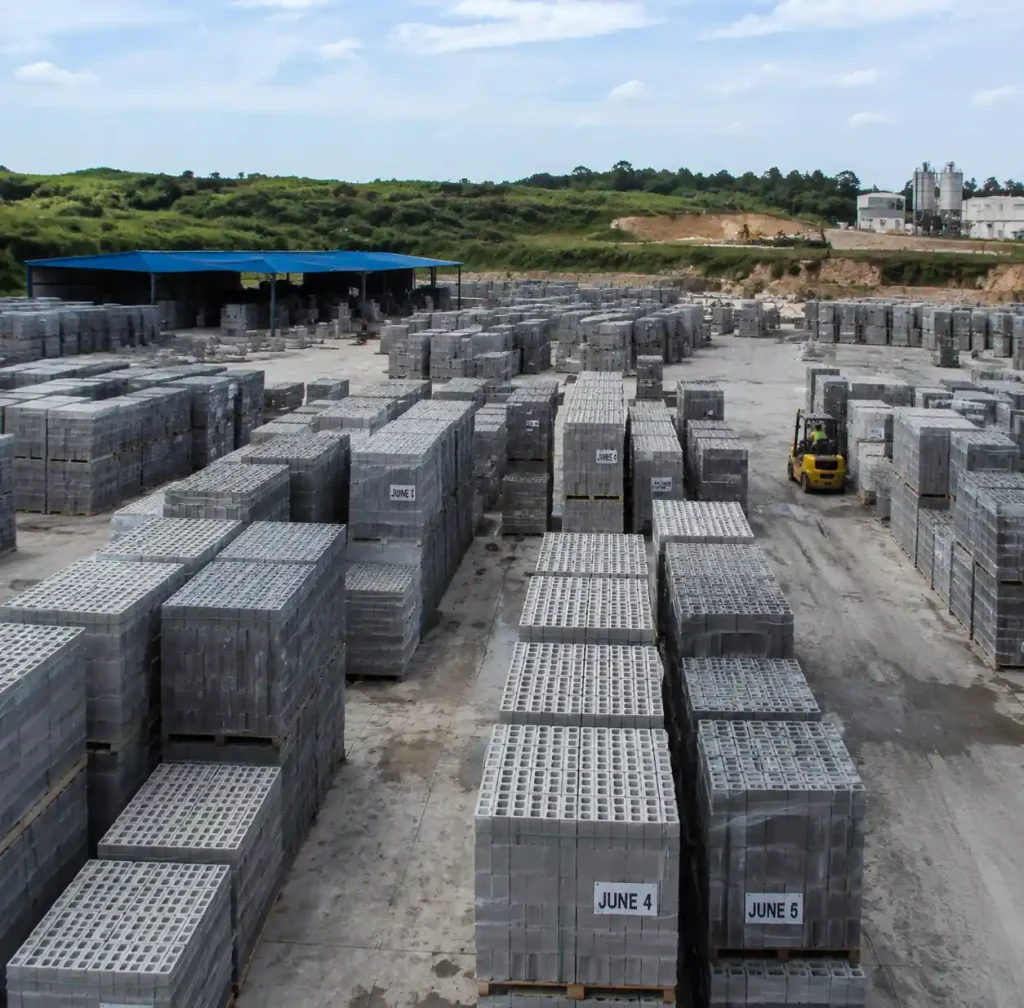 Concrete block curing yard with dated sections showing rotation system