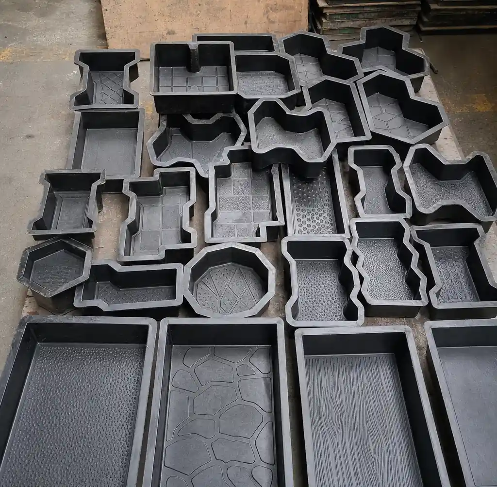 Various paver block mould designs including rectangular and decorative patterns