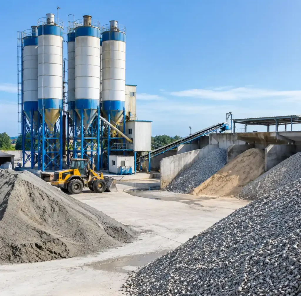 Raw material storage area with cement and aggregates for block production